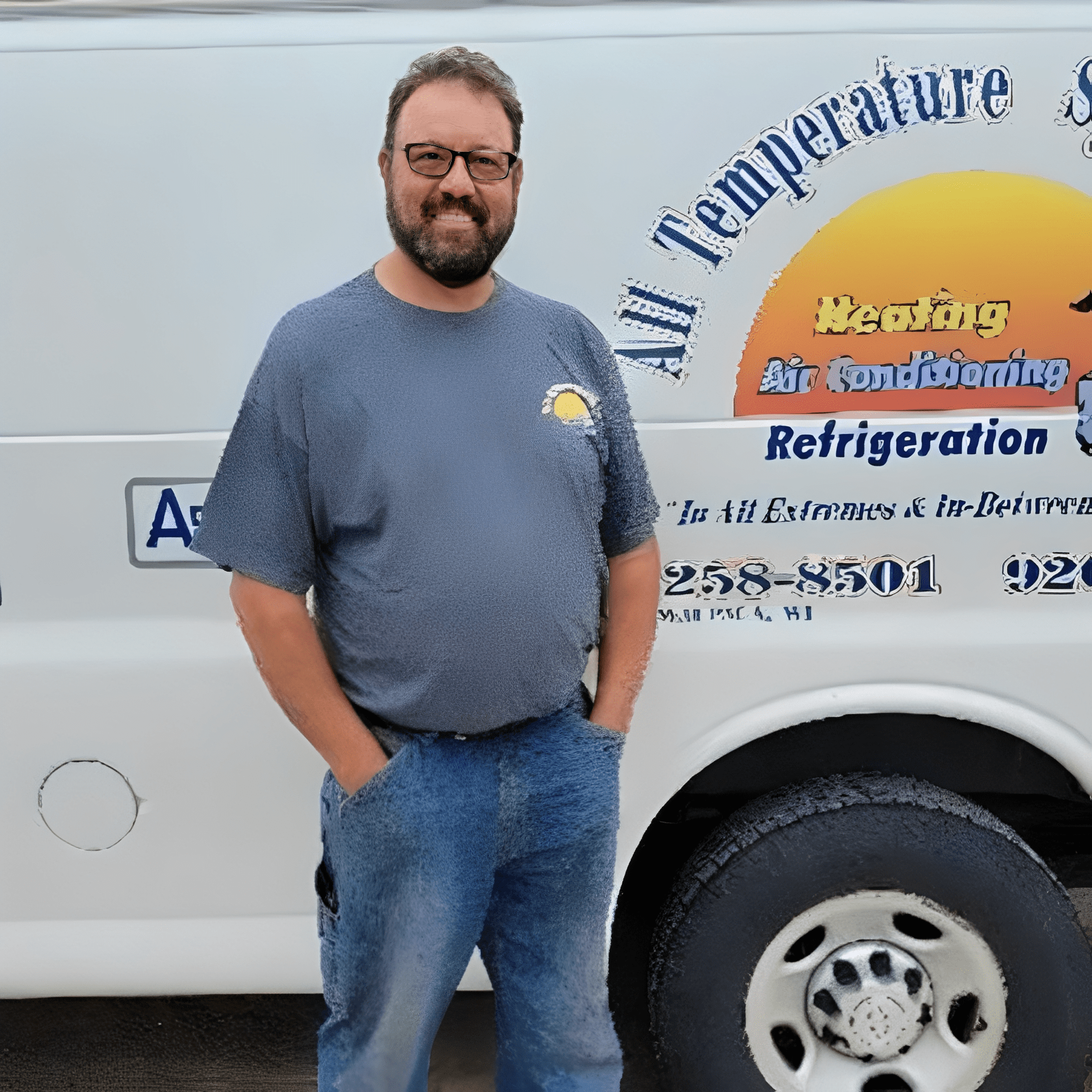Man standing beside a service van.